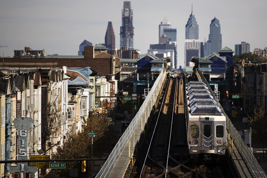 caption: A train moves along the Market-Frankford Line in Philadelphia on Oct. 26, 2016. (Matt Rourke/AP)