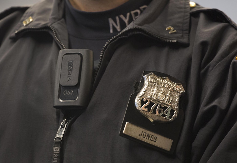 caption: New York Police Department officer Joshua Jones wears a VieVu body camera on his chest during a news conference, Wednesday, Dec. 3, 2014 in New York.
