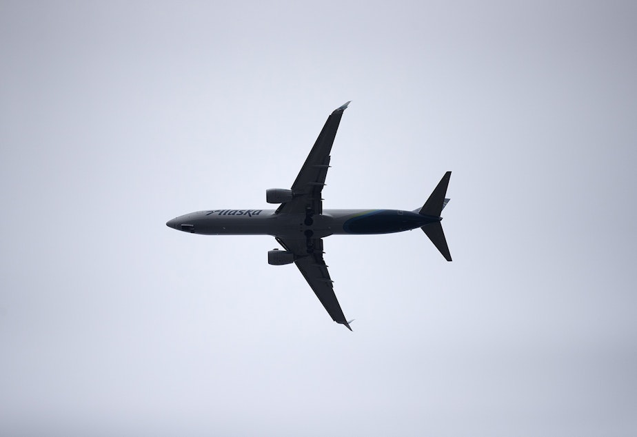 caption: An Alaska airplane is shown on Monday, December 16, 2019, in Renton. 