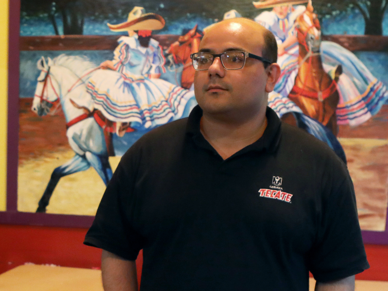 caption: "Black Lives Matter really saved our business," said Salvador Sahagun, who manages a Mexican restaurant near the edge of the zone. He voted for Trump in 2016 and said he might do so again in November.