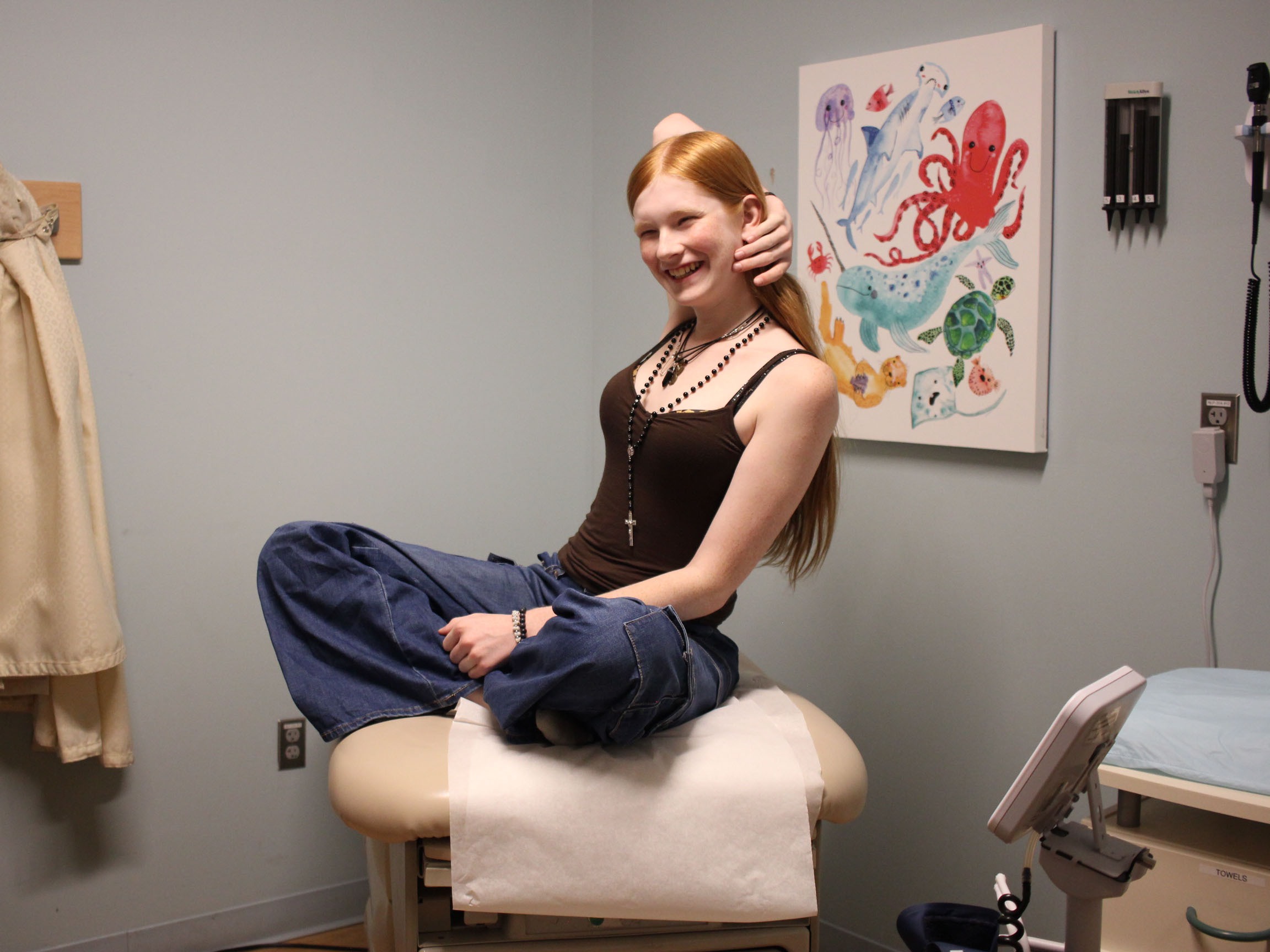 caption: Veronica, 17, drove with her mother nearly four hours from her home in Iowa to visit a doctor in Minneapolis in September. Iowa banned gender-affirming care for youth in March 2023. <br>