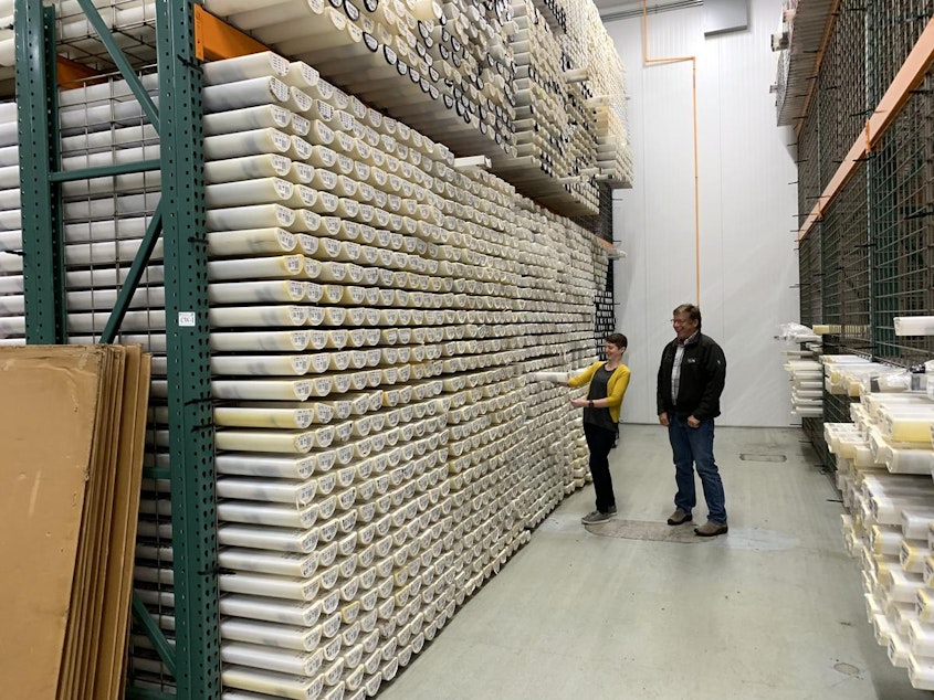 caption: Curator Val Stanley and geologist Chris Goldfinger examine a sediment core in the vast collection of the Marine and Geology Repository at Oregon State University.
