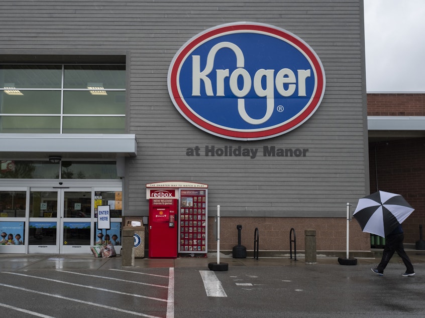 caption: The increase in cases comes after companies such as Kroger ended extra "hero pay" for their workers.