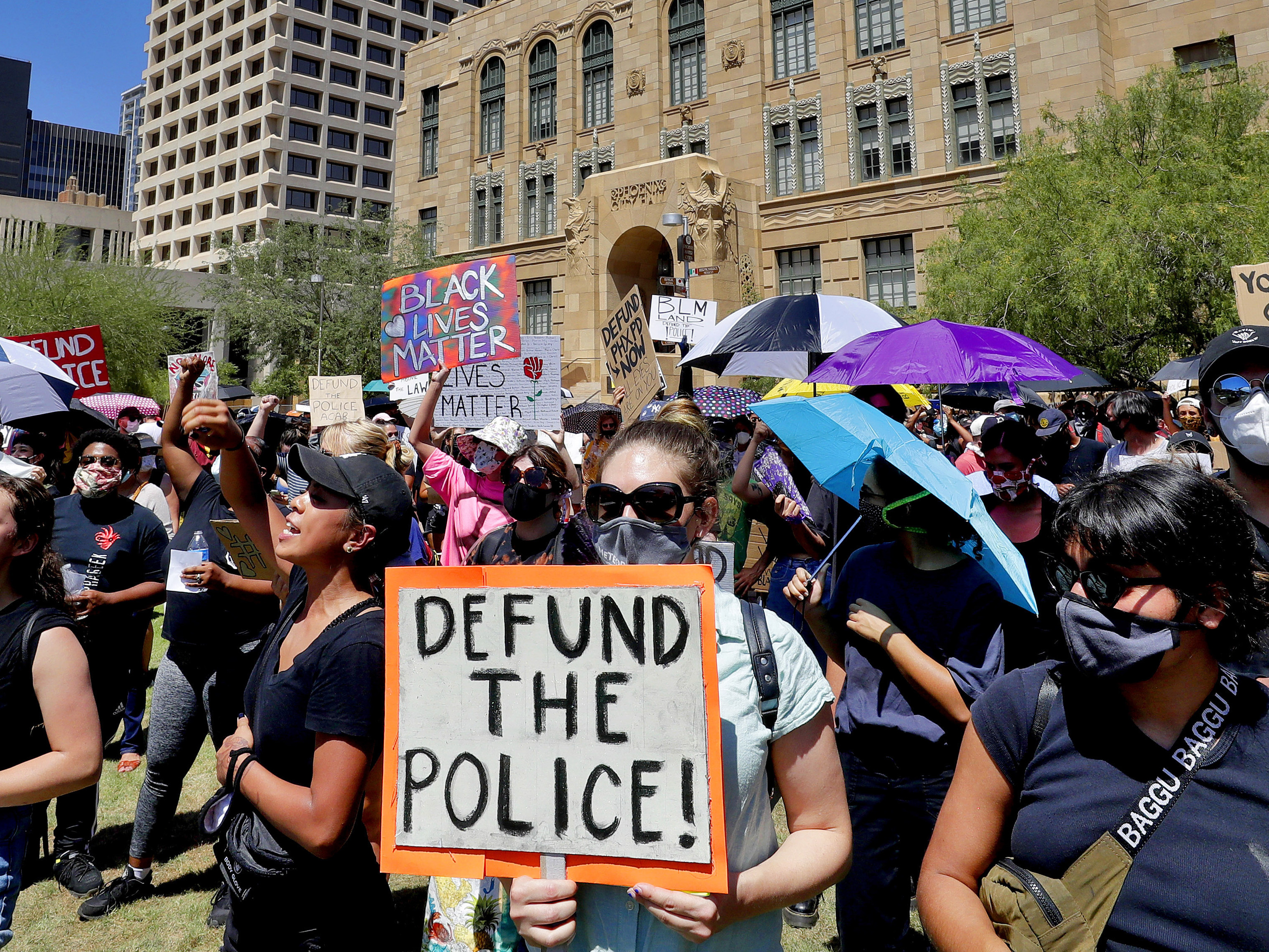 caption: Protesters rally in June of last year in Phoenix demanding that the Phoenix City Council defund the Phoenix Police Department.