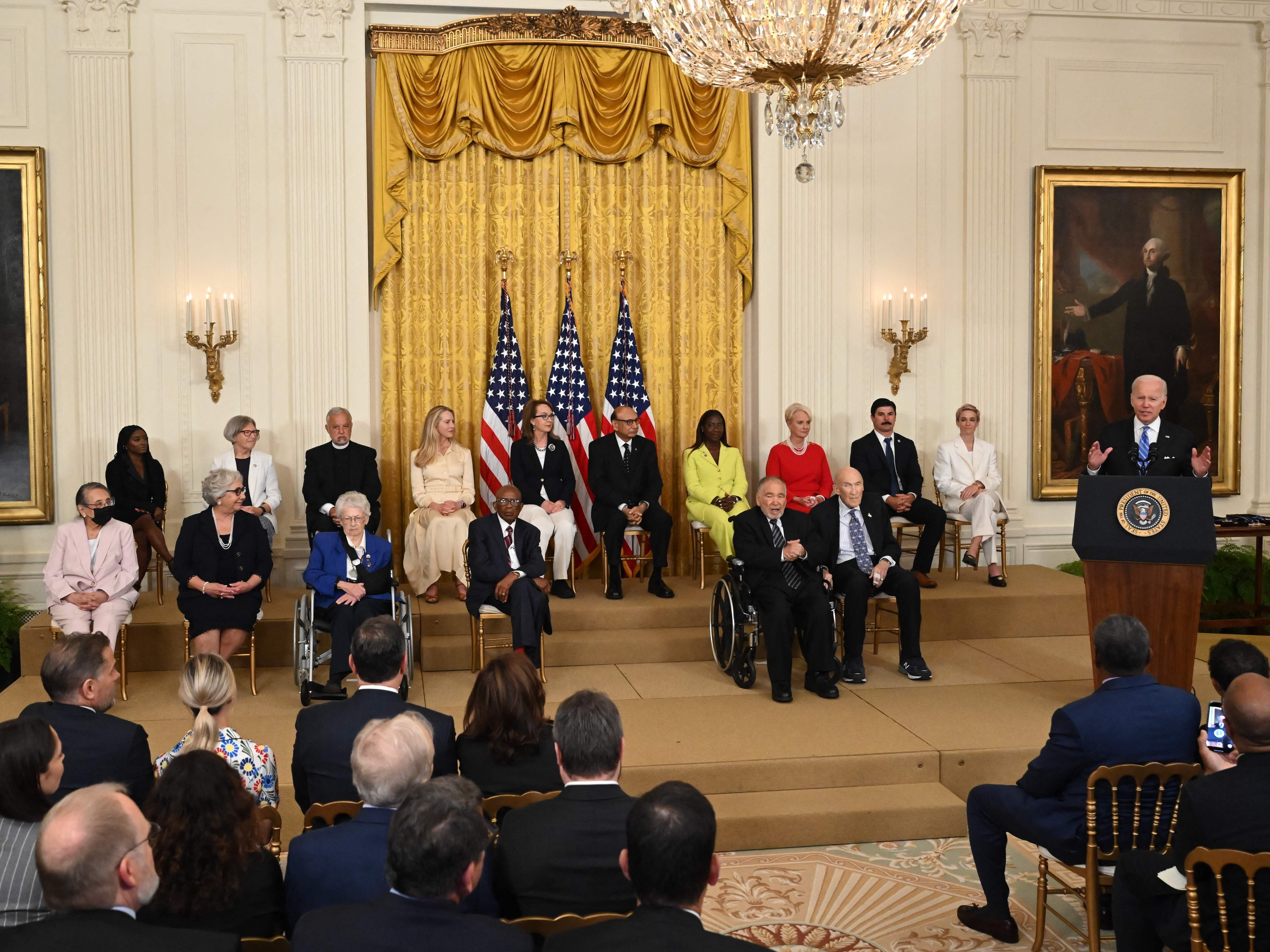 caption: President Joe Biden speaks before presenting the Presidential Medal of Freedom, the nation's highest civilian honor, during a ceremony honoring 17 recipients in the East Room of the White House on Thursday.