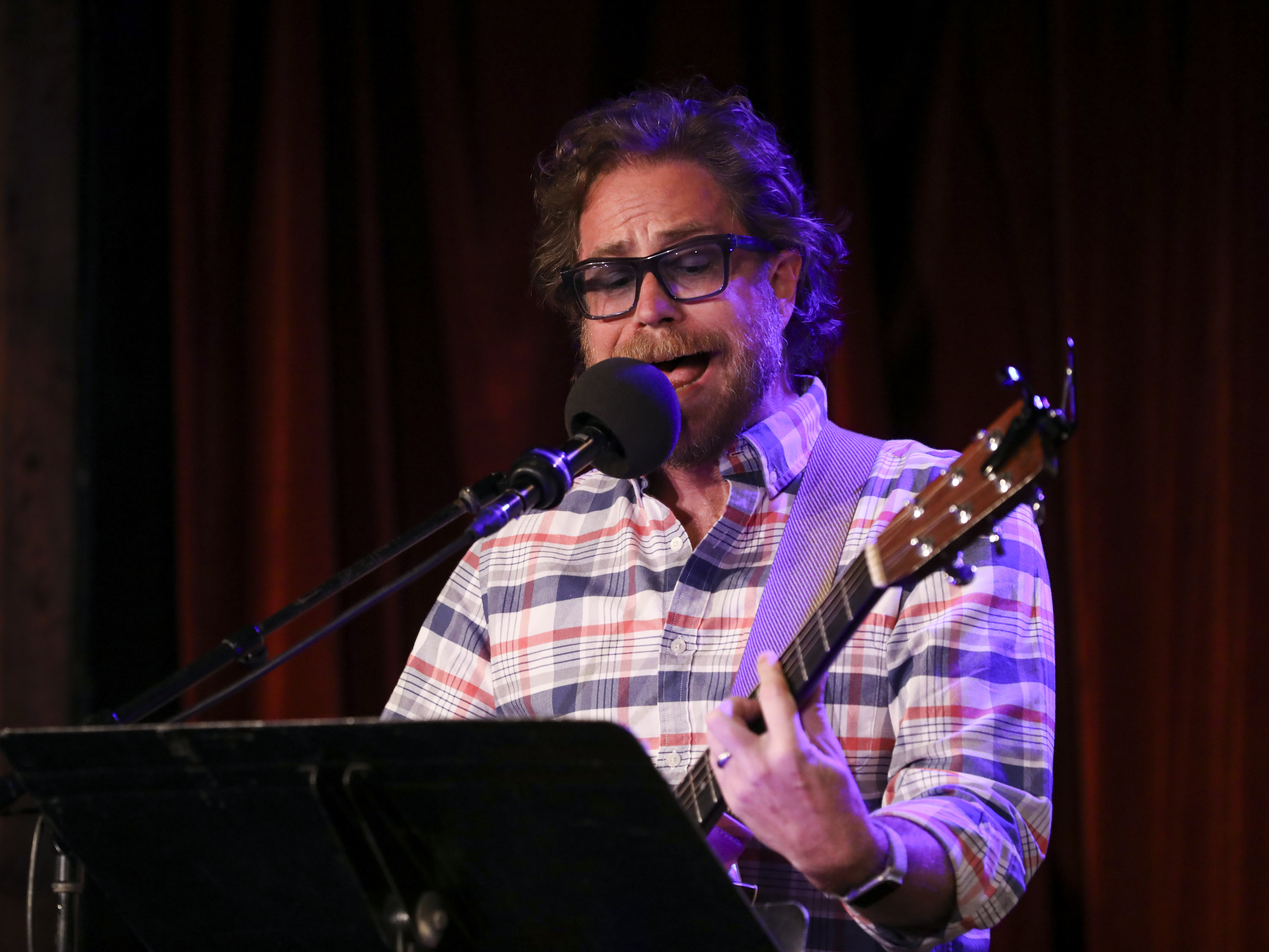 caption: <em>Ask Me Another</em>'s house musician Jonathan Coulton leads a music parody game at the Bell House in Brooklyn, New York.