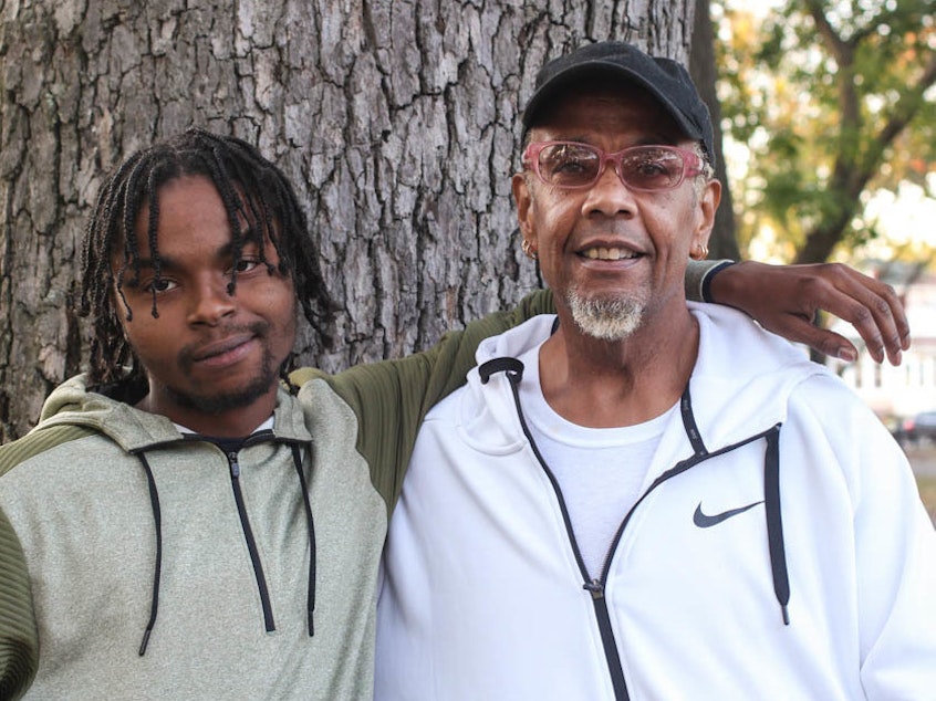 caption: Before Guy Bryant (right) took Romario Vassell (left) into foster care, Vassell had been living in a homeless shelter.