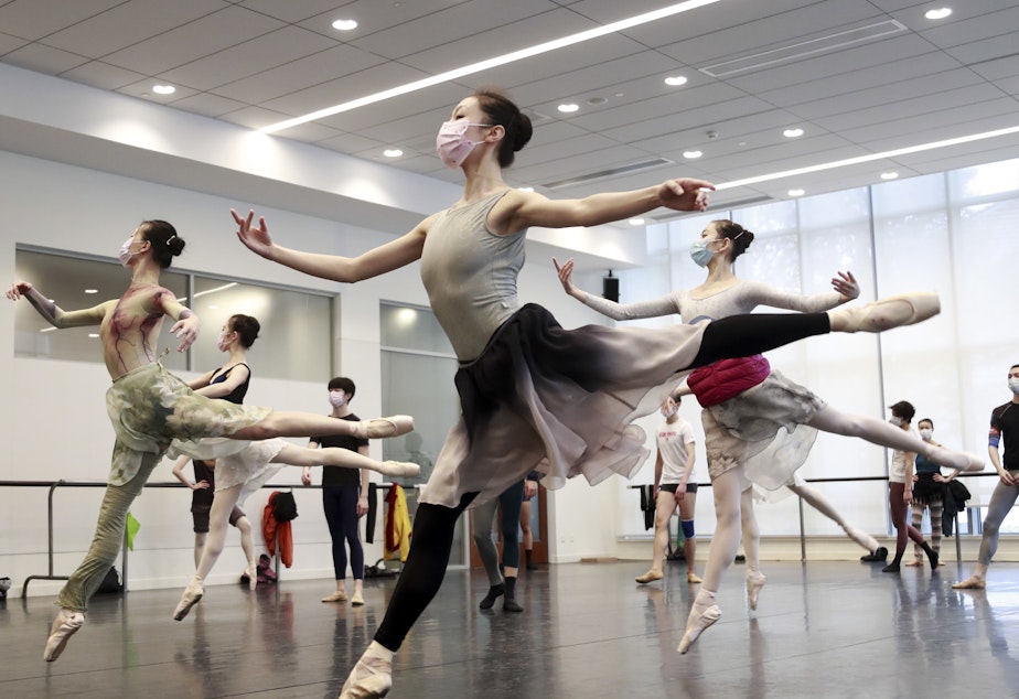 caption: Ballet dancers in Shanghai rehearse while wearing masks on March 2. A virus first identified in December has altered daily life and public spaces around the globe.