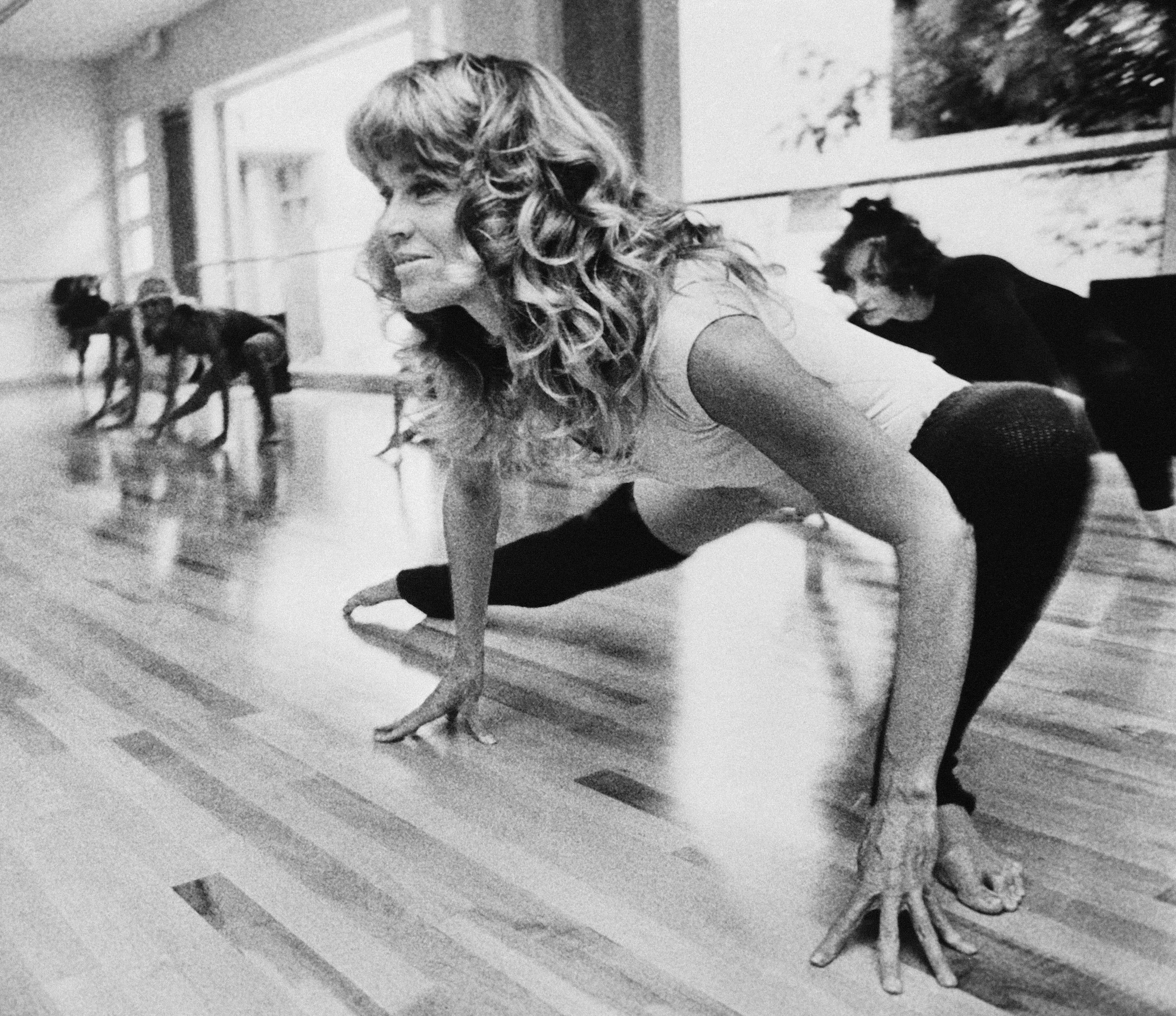 caption: At the outset, the money from Fonda's workout videos went to the Campaign for Economic Democracy, an organization she co-founded with her second husband, Tom Hayden. Above, she exercises in her Beverly Hills studio in September 1979.