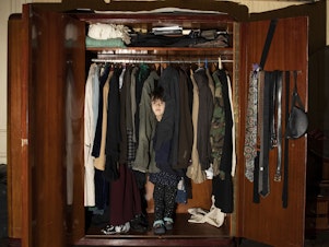 caption: My niece, Nisime, in her hiding place — my parents' closet. She is my muse during the quarantine days. <em>April 3, 2020. Tbilisi, Georgia</em>