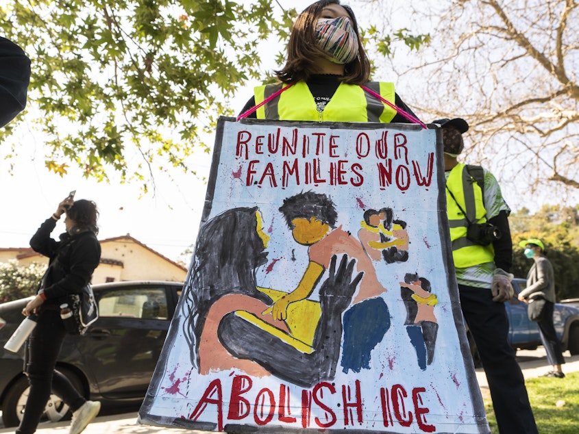 caption: Protestors participate March 6 in the "Reunite Our Families Now!'' rally in Los Angeles to protest continued deportations and demand family and children reunifications.