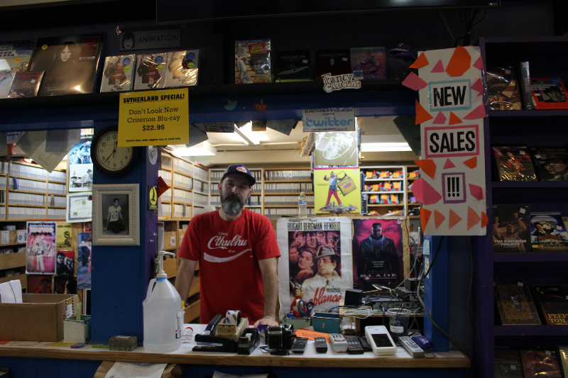 caption: Seattle's Scarecrow Video has more than 148,000 titles, and adds about 4,000 new titles each year. It's among the largest video collections in the United States. Seen here, Jamie Han works the front desk. 
