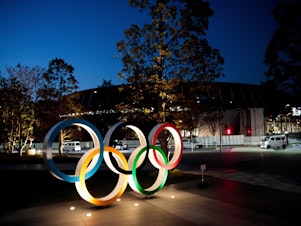 caption: The Olympic rings displayed outside the National Stadium, a venue for the 2020 Olympic Games, in Tokyo last year. The Games have been delayed until 2021 because of the coronavirus.