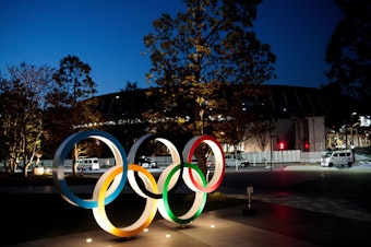 caption: The Olympic rings displayed outside the National Stadium, a venue for the 2020 Olympic Games, in Tokyo last year. The Games have been delayed until 2021 because of the coronavirus.