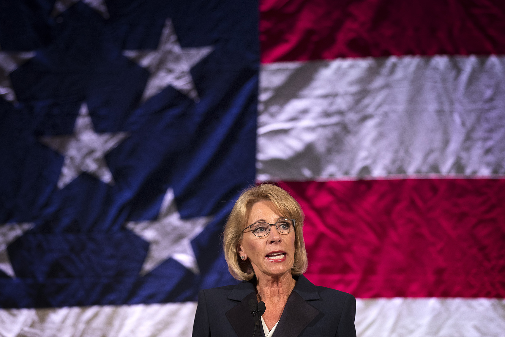 caption: FILE: Secretary of Education Betsy DeVos speaks at the Washington Policy Center's annual gala on Friday, October 13, 2017, at the Hyatt Regency in Bellevue.