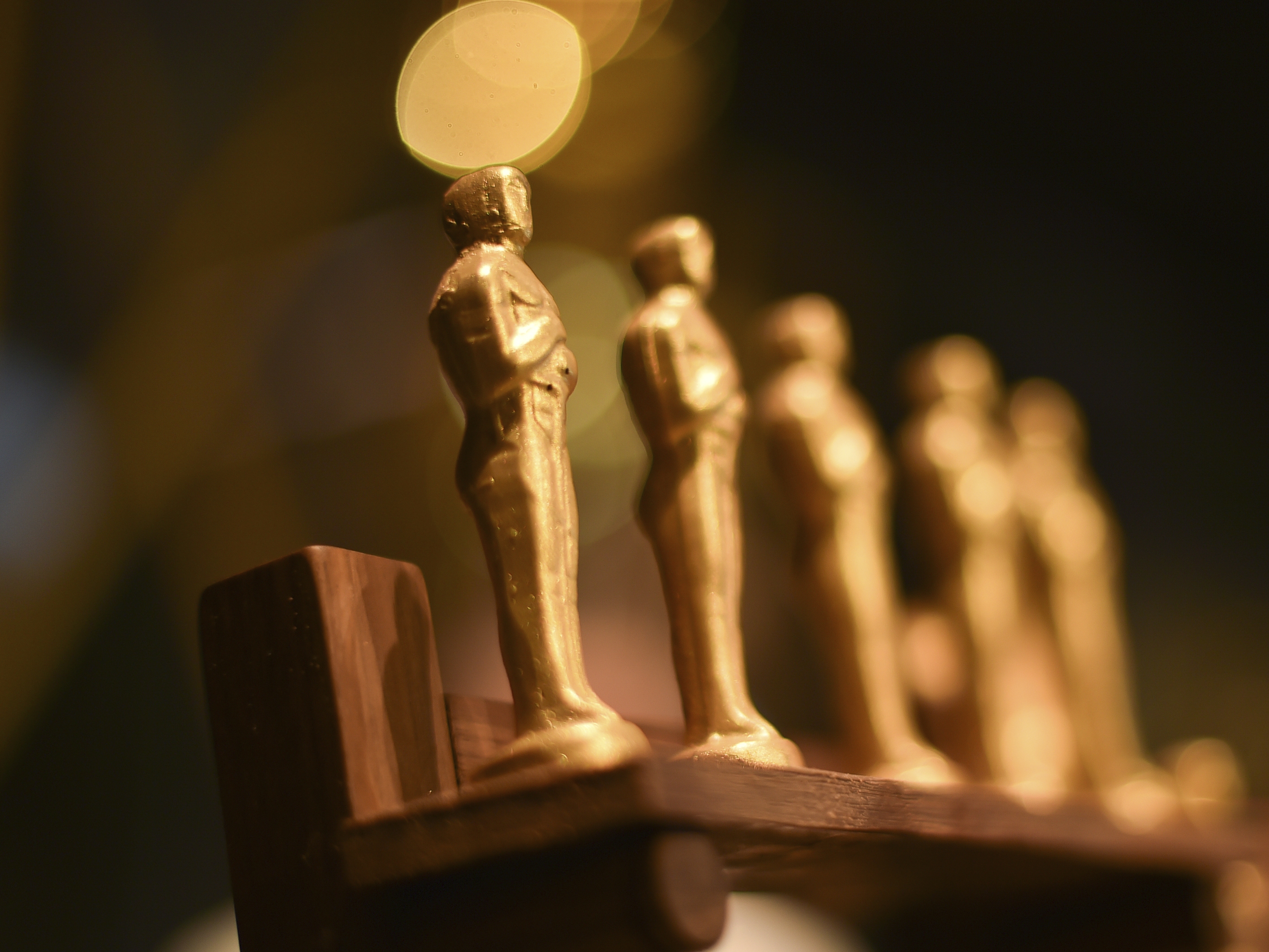 caption: Oscar statues in a press preview in February 2025.