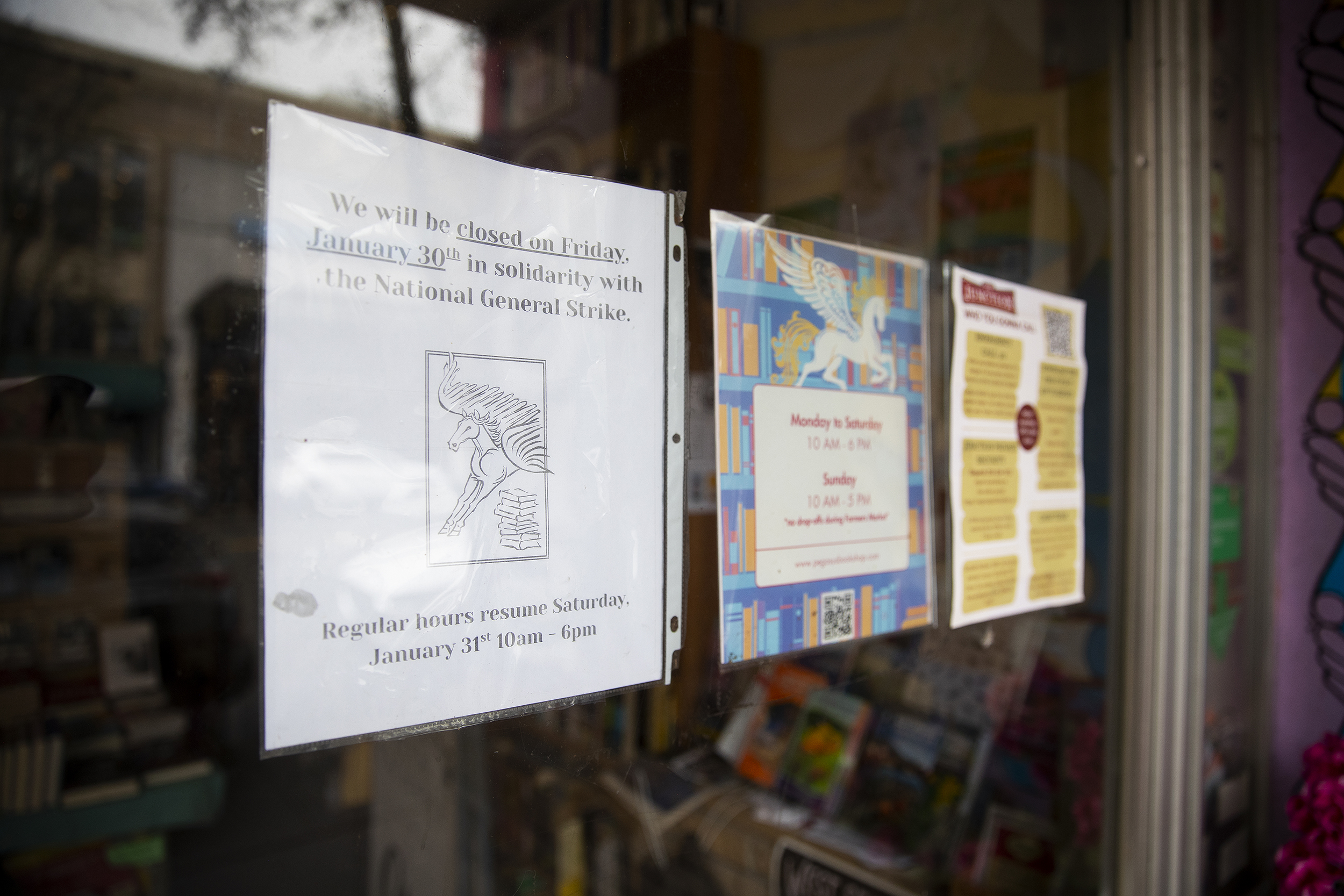 caption: Pegasus Book Exchange is shown closed for business, in solidarity with the national general strike, on Friday, January 30, 2026, in West Seattle. 