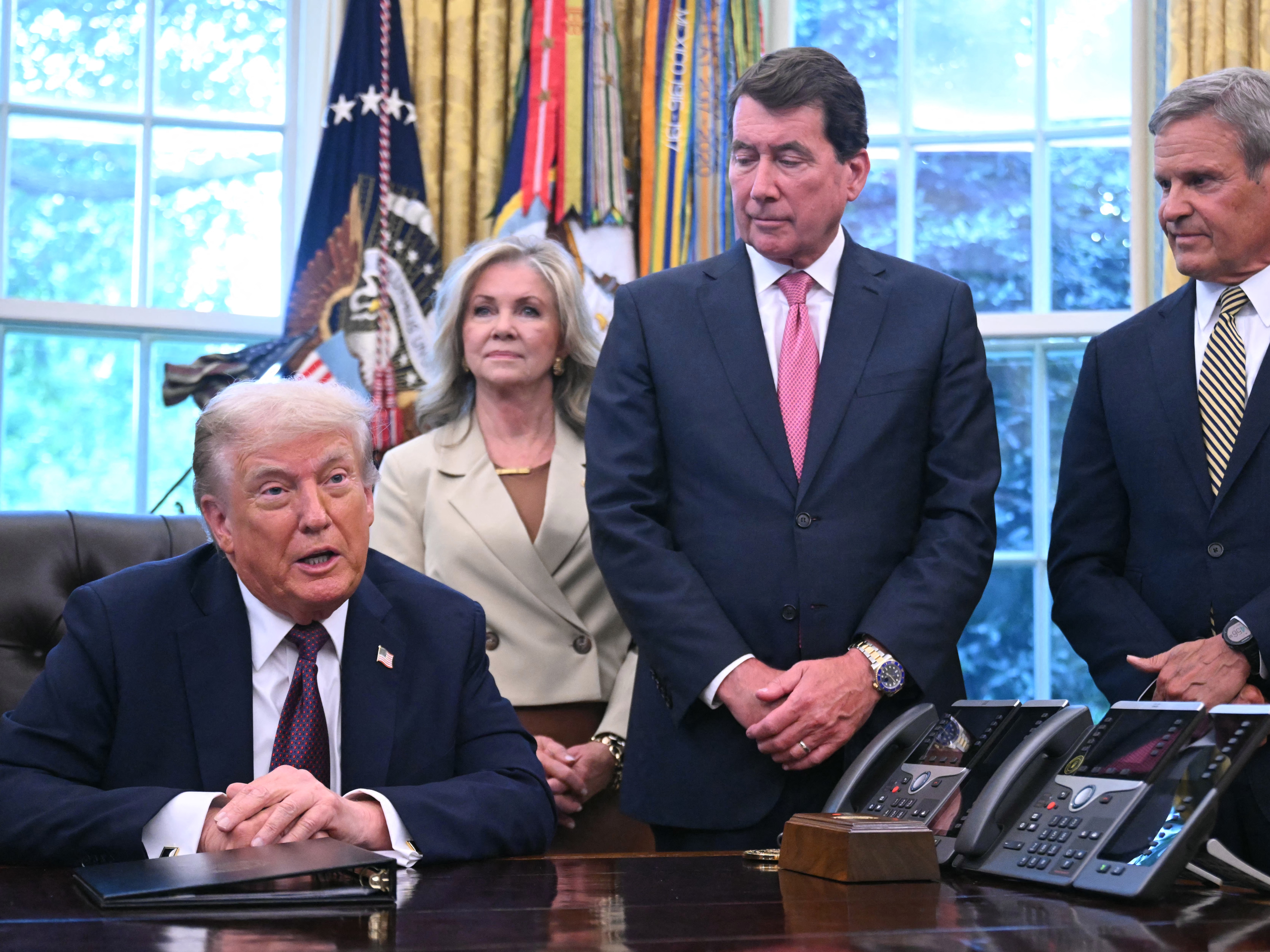caption: President Trump speaks in the Oval Office on Sept. 15 before signing a memorandum to send National Guard troops to Memphis, Tenn., as U.S. Sen. Marsha Blackburn, R-Tenn., (from left), U.S. Sen. Bill Hagerty, R-Tenn., and Republican Tennessee Gov. Bill Lee look on.