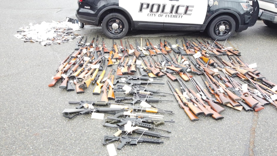 caption: Firearms that were turned into the Everett Police Department on Dec. 17, 2022 in exchange for gift cards. EPD paid out $25,000 in gift cards in exchange for the guns. 