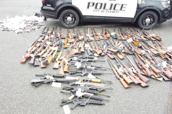 caption: Firearms that were turned into the Everett Police Department on Dec. 17, 2022 in exchange for gift cards. EPD paid out $25,000 in gift cards in exchange for the guns. 