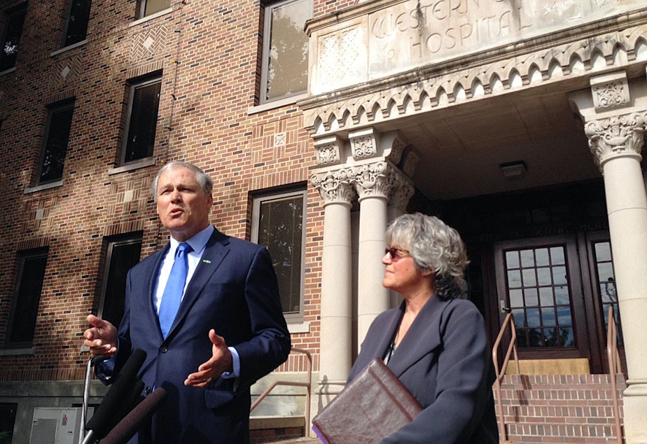 caption: Washington Gov. Jay Inslee, pictured here outside Western State Hospital, is proposing the state explore building a new state hospital.