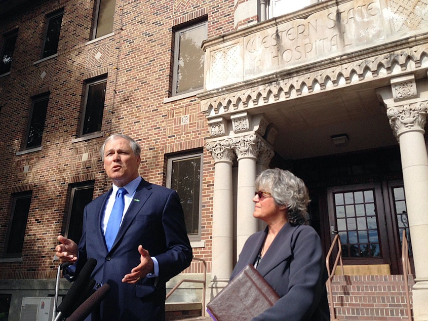 caption: Washington Gov. Jay Inslee, pictured here outside Western State Hospital, is proposing the state explore building a new state hospital.