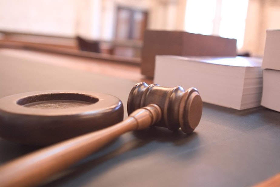 caption: A courtroom gavel.