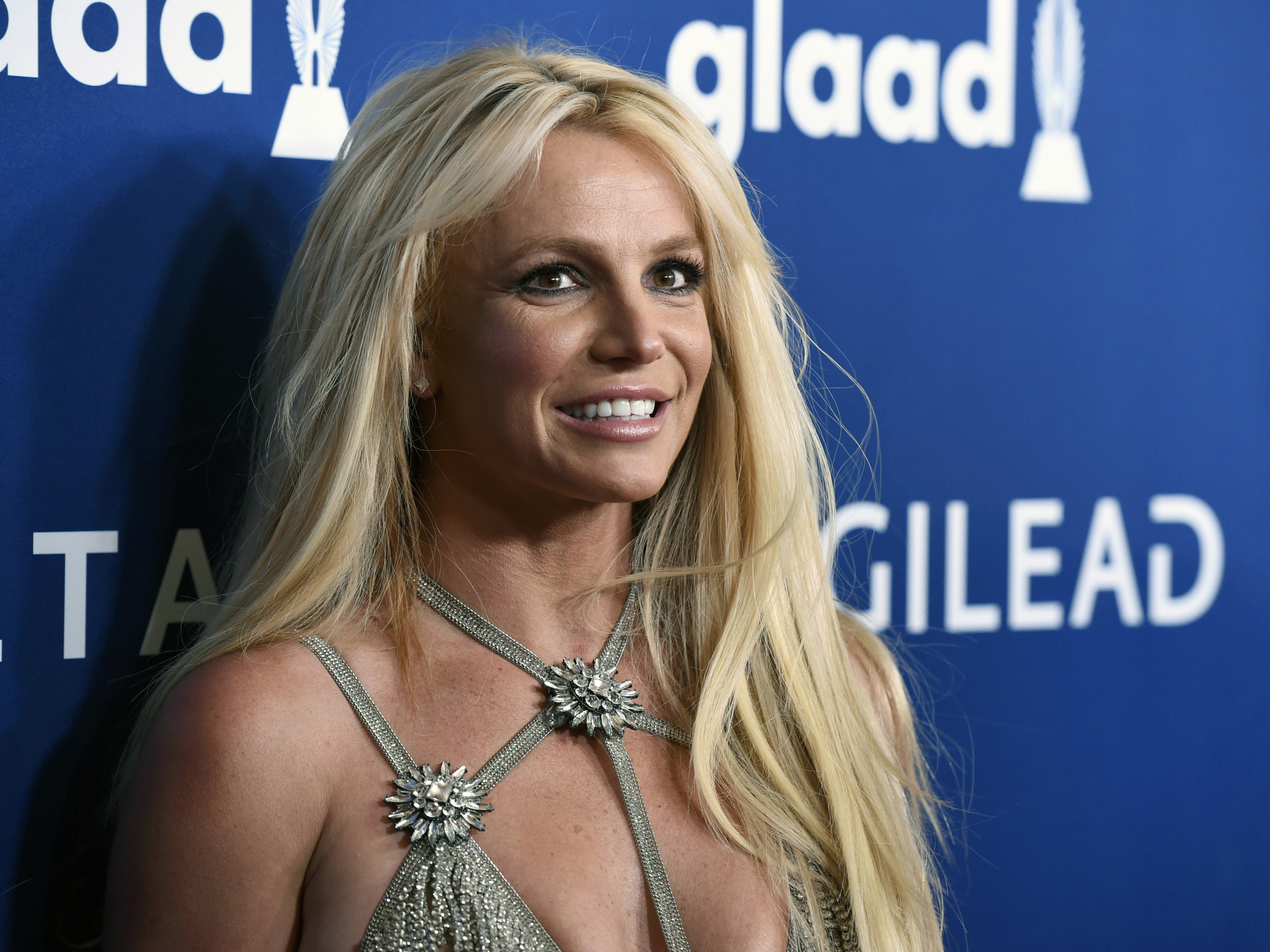 caption: This April 12, 2018 file photo shows Britney Spears at the GLAAD Media Awards in Beverly Hills, Calif. Spears announced Monday she's pregnant.