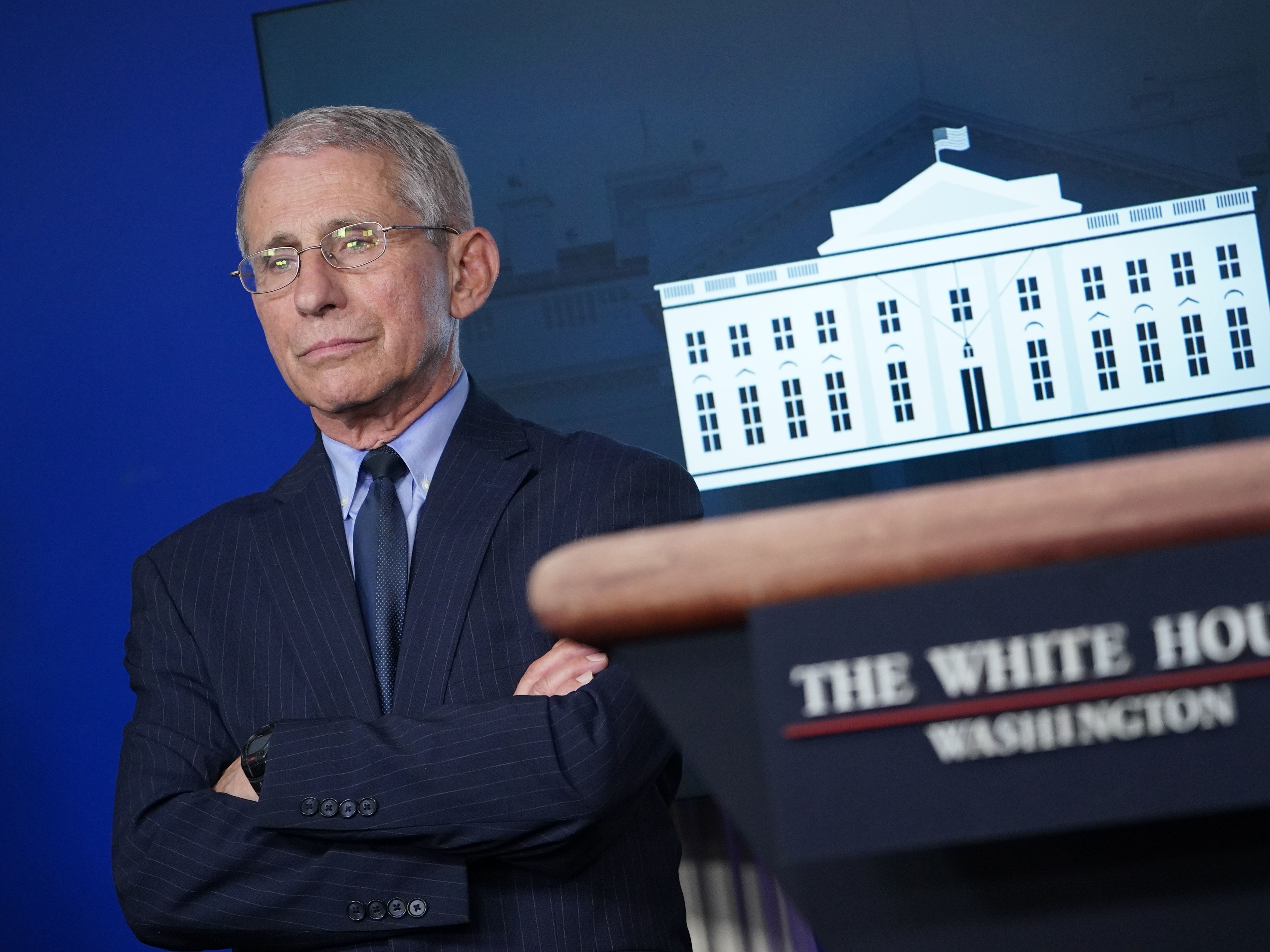 caption: Director of the National Institute of Allergy and Infectious Diseases Anthony Fauci looks on during the daily briefing on the coronavirus in the White House briefing room on April 1.