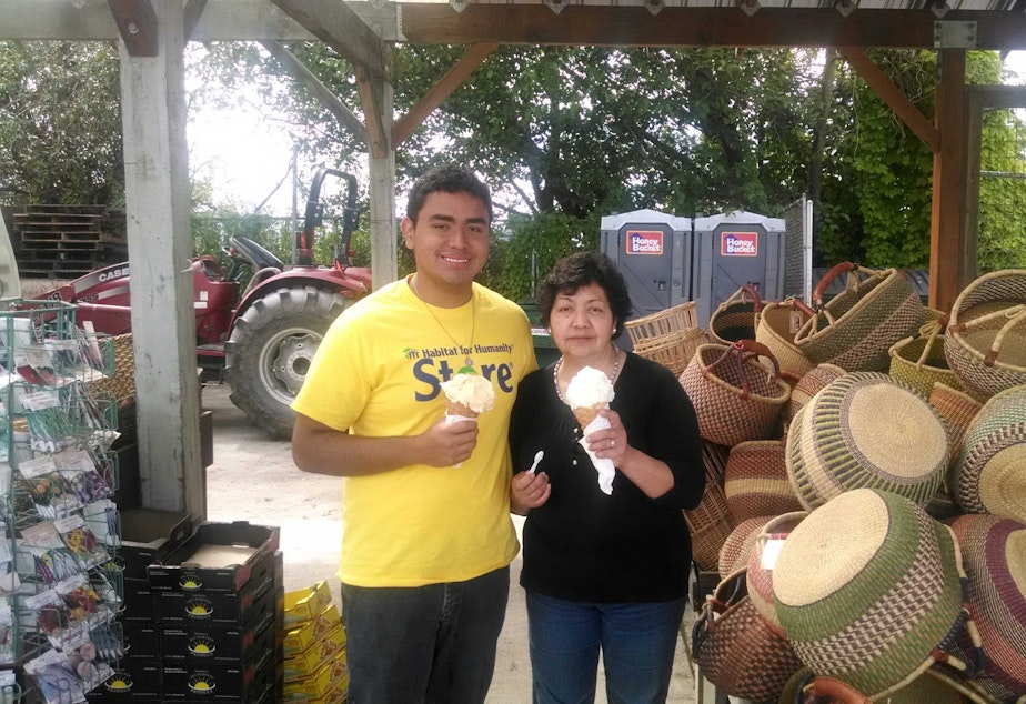 caption: Juan Andres Macedo with his mother at a farm stand in Mount Vernon. Macedo will be in the audience at the State of the Union address on Tuesday evening.