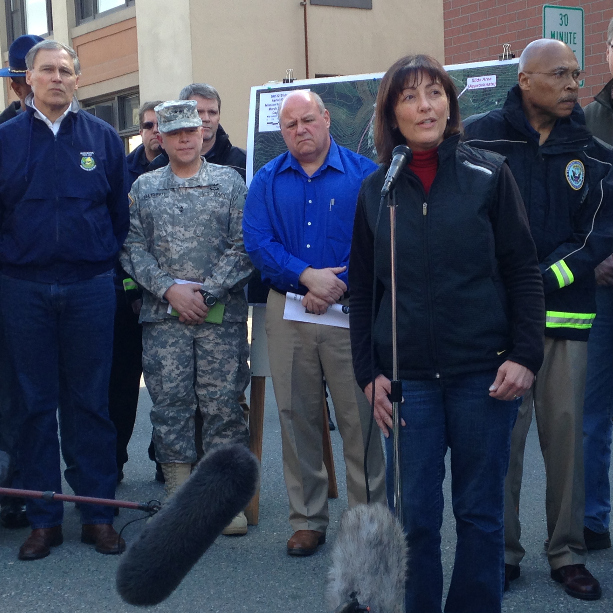 caption: Representative Suzan DelBene speaking at a press conference on Sunday, March 23, 2014, in Arlington, Wash.