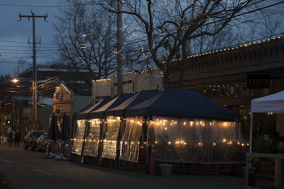 caption: Outdoor dining areas are set up outside of Gracia on Sunday, November 15, 2020, along Ballard Ave Northwest in Seattle.