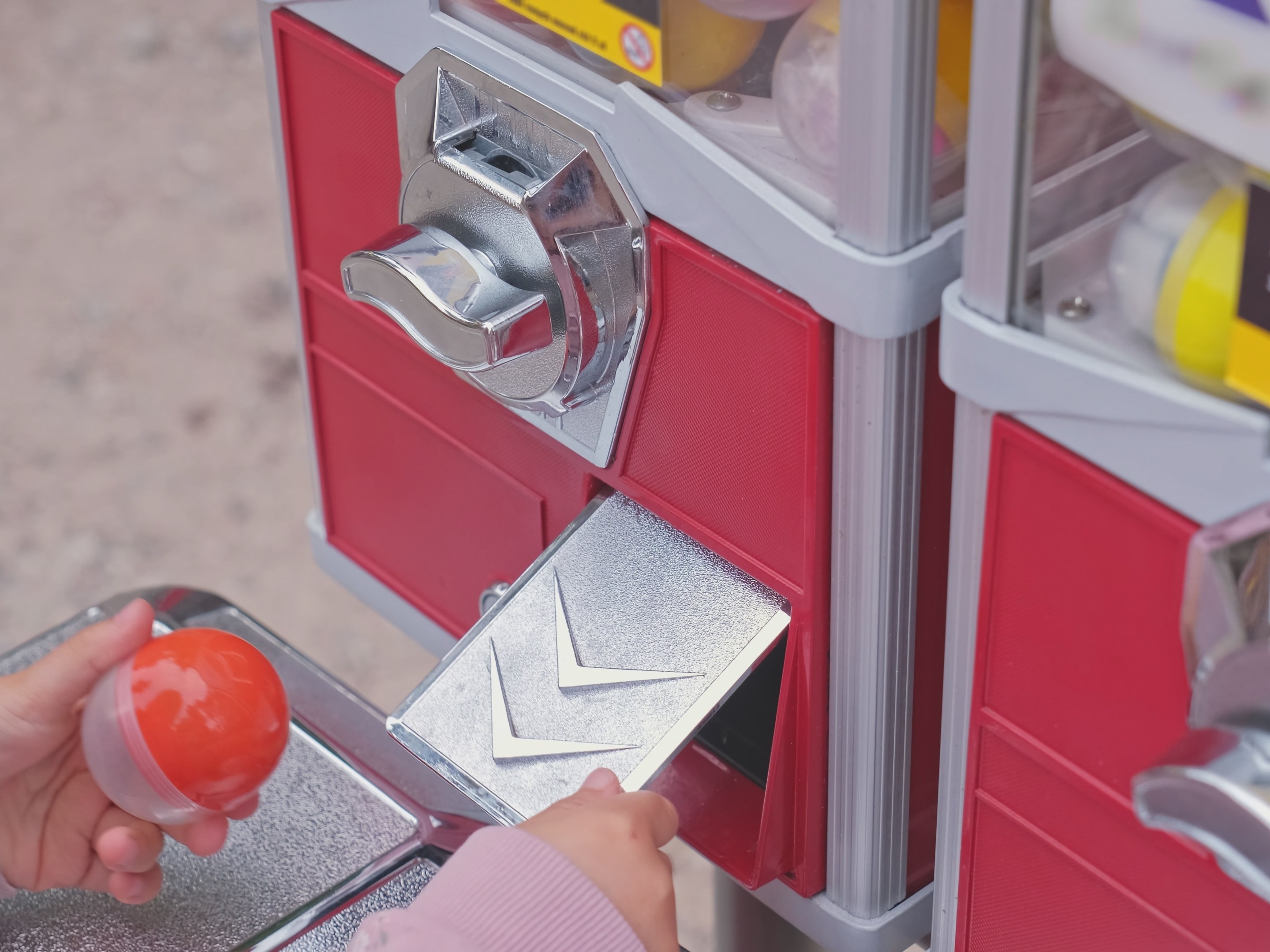 caption: Scientists used a gumball machine filled with toys to test how toddlers learned when they thought something was impossible or just improbable.