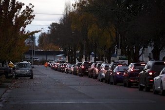 caption: A line of vehicles is shown on Wednesday, November 18, 2020, at the Covid-19 testing site on Southwest 10th Street in Renton. 
