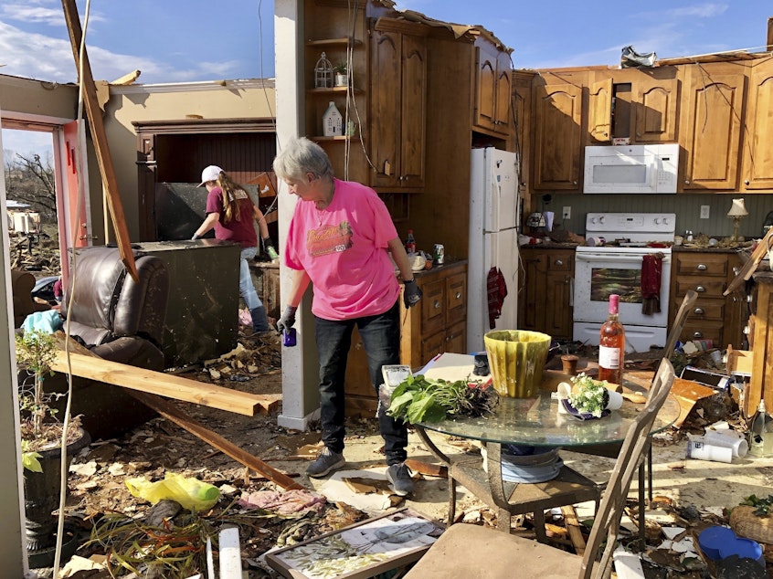 caption: Patti Herring sobs as she sorts through the remains of her home in Fultondale, Ala., on Tuesday, after her house was destroyed by a tornado.