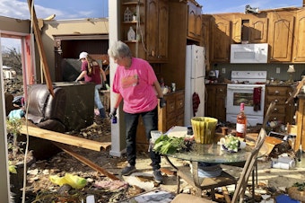 caption: Patti Herring sobs as she sorts through the remains of her home in Fultondale, Ala., on Tuesday, after her house was destroyed by a tornado.