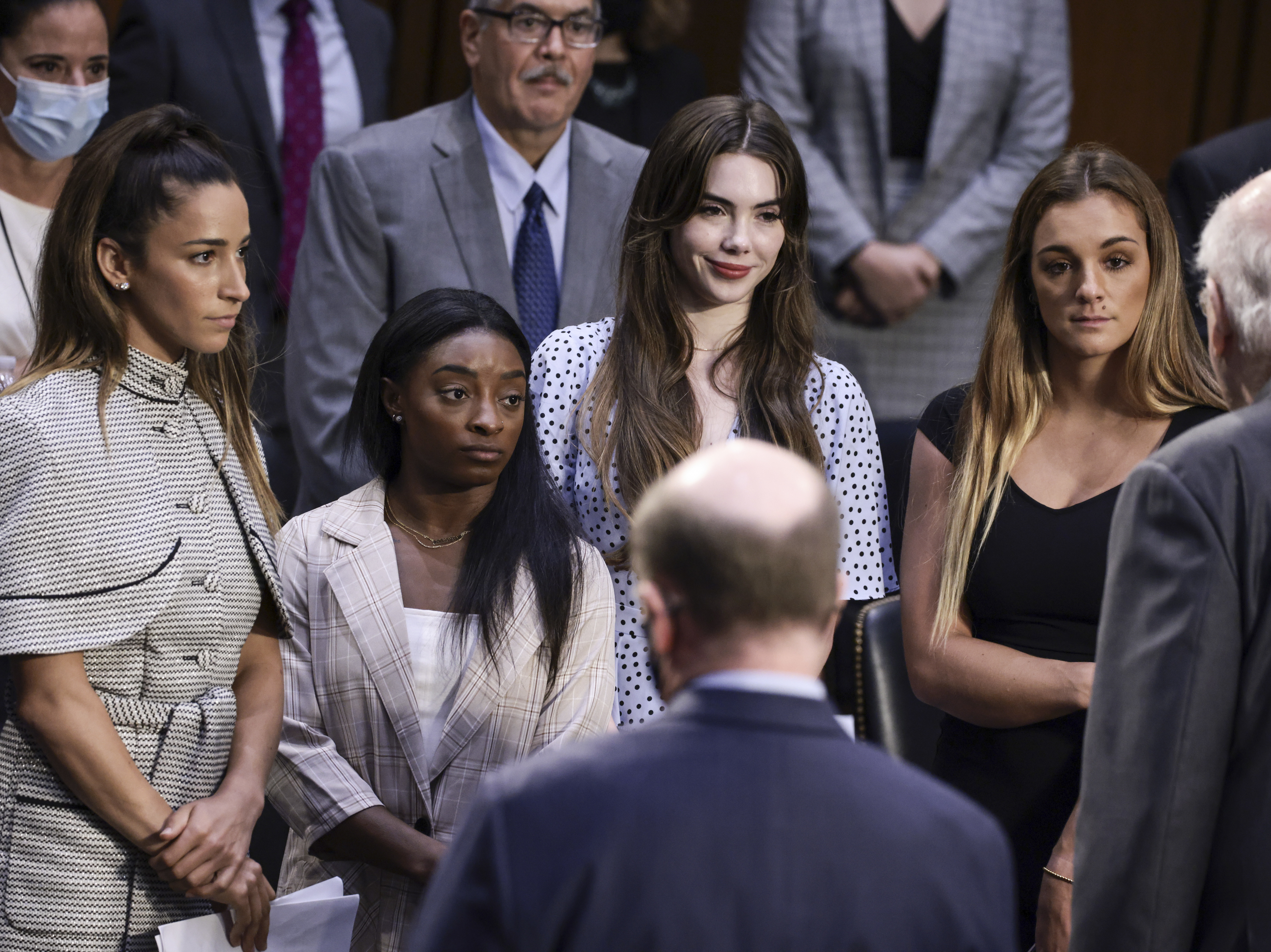 caption: From left, U.S. Olympic gymnasts Aly Raisman, Simone Biles, McKayla Maroney and NCAA and world champion gymnast Maggie Nichols are shown after their testimony during a Senate Judiciary hearing on Sept. 15 about the FBI handling of the investigation of Larry Nassar's sexual abuse of gymnasts.