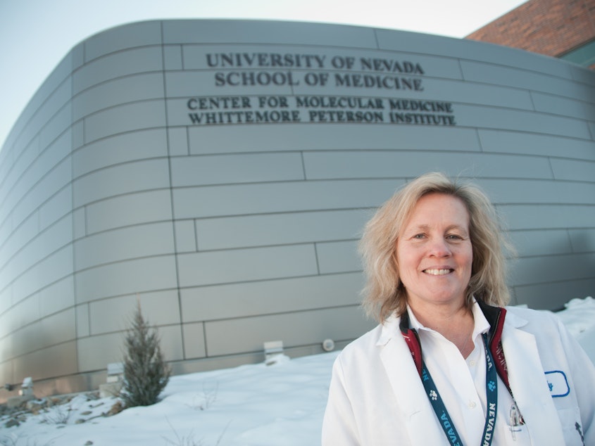 caption: Dr. Judy A. Mikovits shown outside the Whittemore Peterson Institute for Neuro-Immune Disease, in Reno, Nevada, in 2011. Mikovits makes a number of questionable claims in a newly viral conspiracy video.