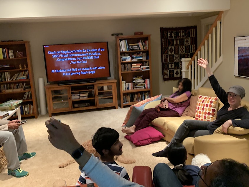 caption: Lila Shroff, a senior at Mercer Island High School, and her family, gather in the basement of their home for the virtual portion of the graduation ceremony on Tuesday, June 9, 2020. Pictured are Shroff’s cousin, Sidh Shroff, her uncle, Sharat Shroff, her mother, Sarah Ford, and her grandmother, Savitri Shyam. Despite the nontraditional format of the virtual ceremony, Shroff enjoyed the unique opportunity to watch the speeches together with her family.