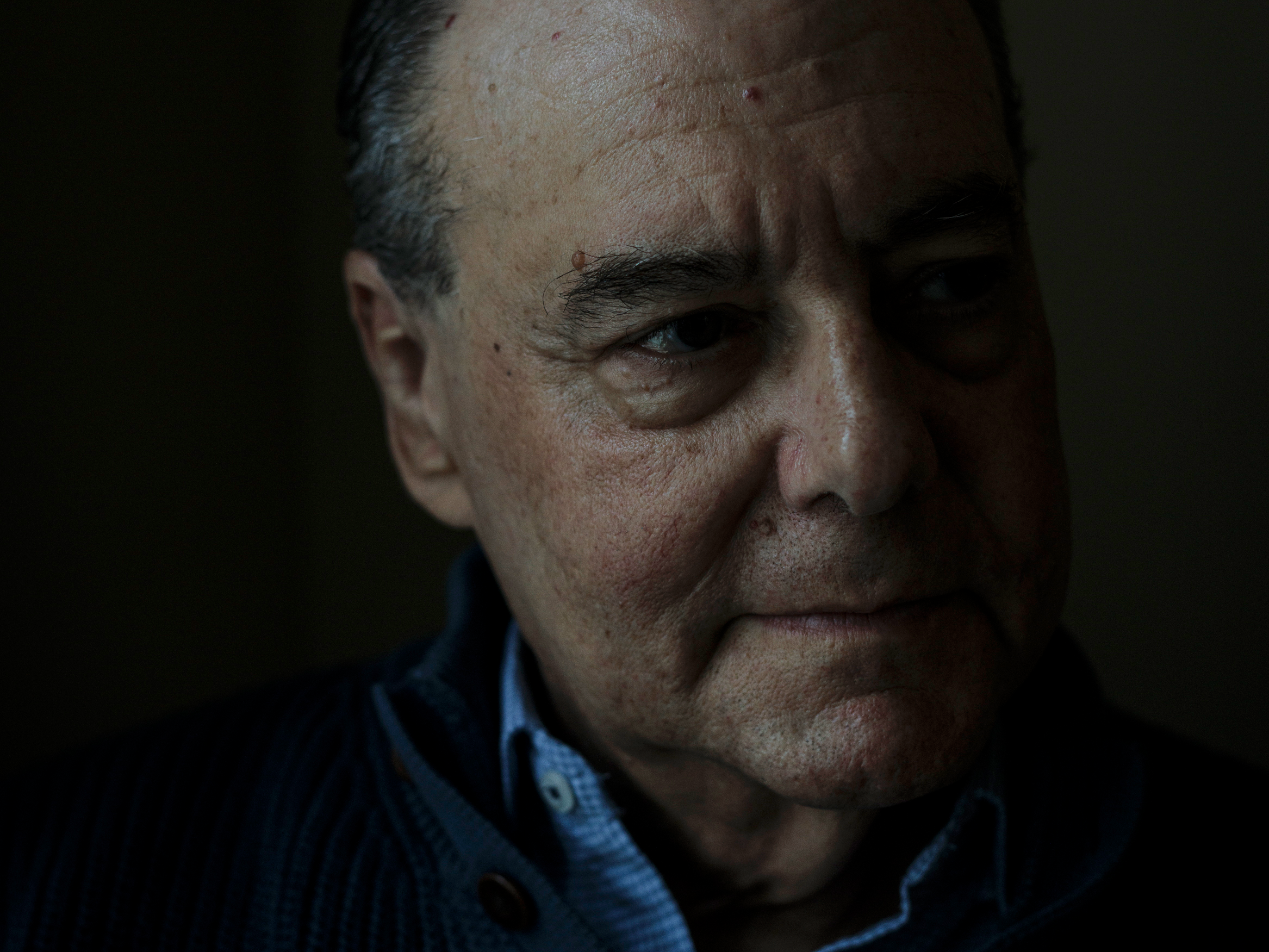 caption: Dan Stein poses for a portrait at his home in Rockville, Md., on Tuesday, May 13, 2025.