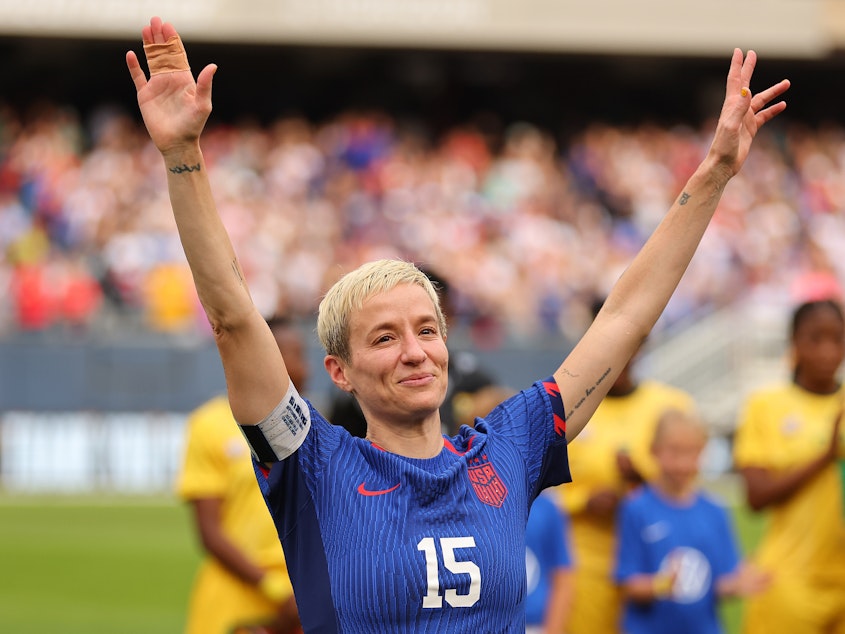 caption: Megan Rapinoe waves to the crowd before her final game on the U.S. national team on Sunday in Chicago.