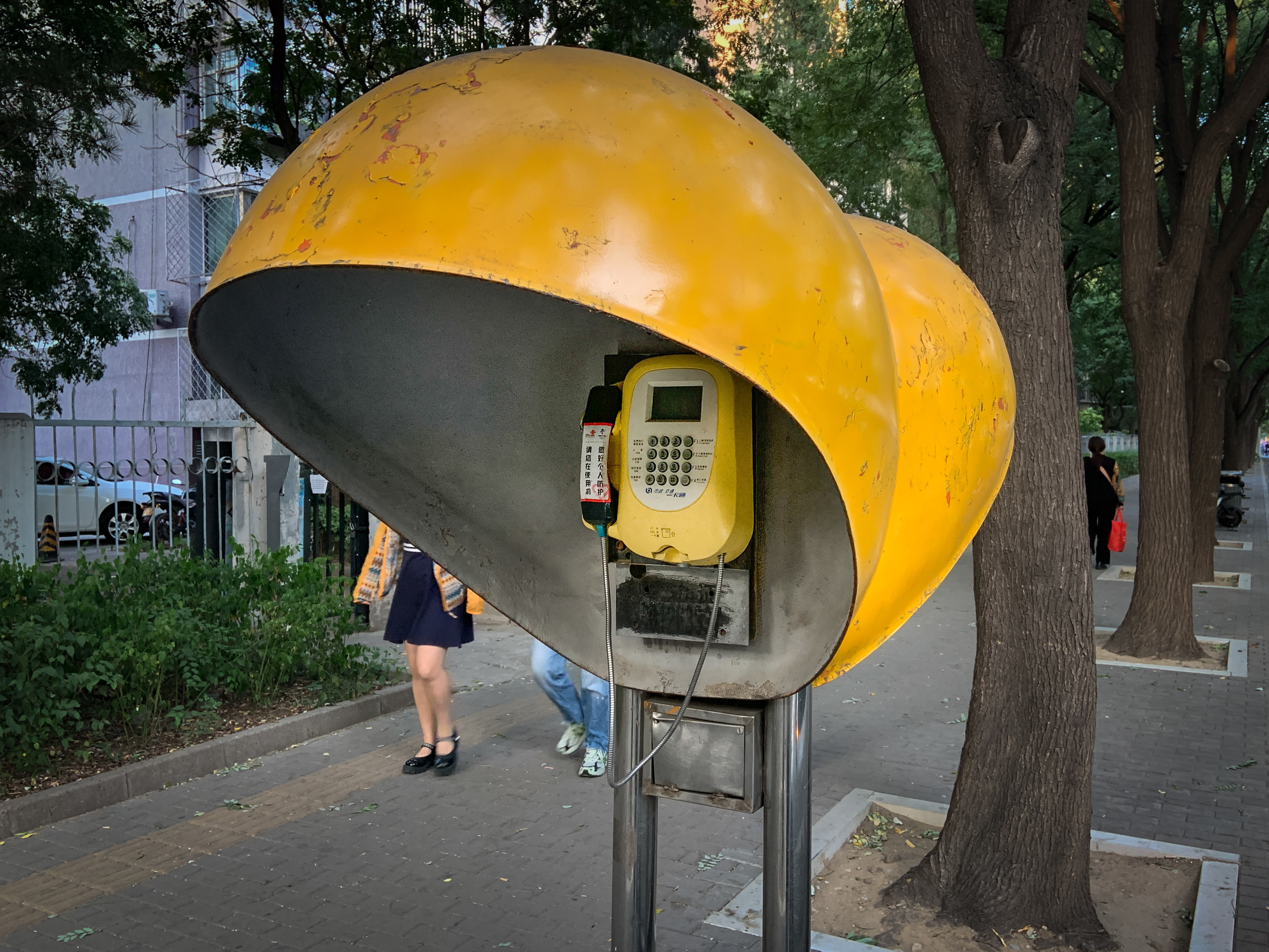caption: In July, this Beijing payphone began ringing. Who was calling?