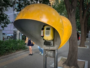 caption: In July, this Beijing payphone began ringing. Who was calling?