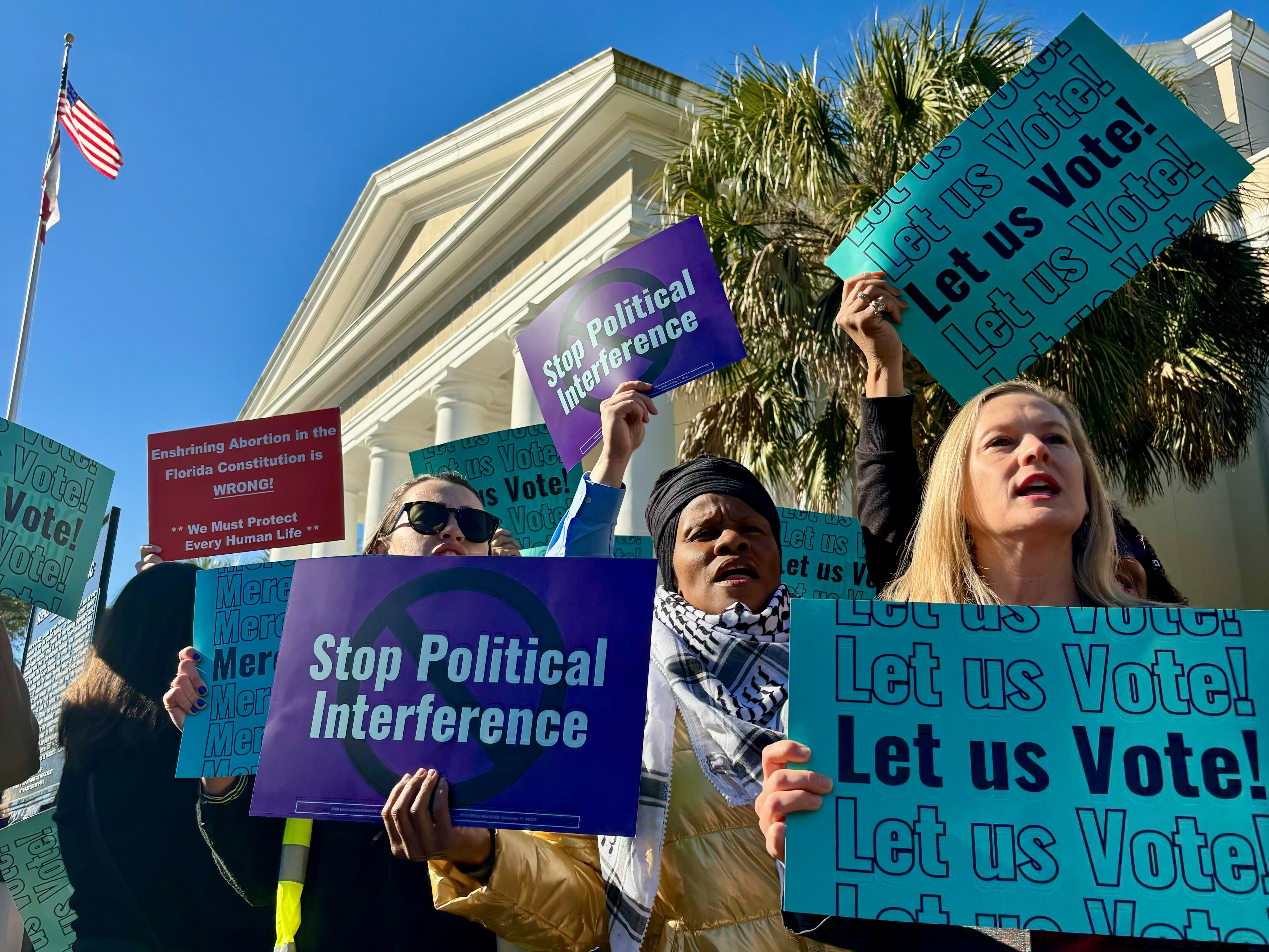 caption: Abortion access advocates are chanting and waiving signs outside the Florida Supreme Court. Inside, justices have just heard arguments on the ballot language for a proposed state constitutional amendment that would protect abortion access up to the point of viability.