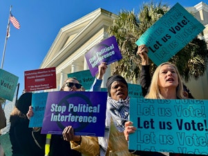 caption: Abortion access advocates are chanting and waiving signs outside the Florida Supreme Court. Inside, justices have just heard arguments on the ballot language for a proposed state constitutional amendment that would protect abortion access up to the point of viability.