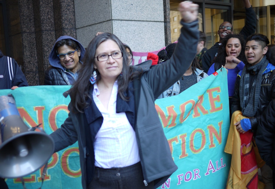 caption: Immigrant rights activist Maru Mora Villalpando speaks to supporters after an initial court hearing on her deportation case.