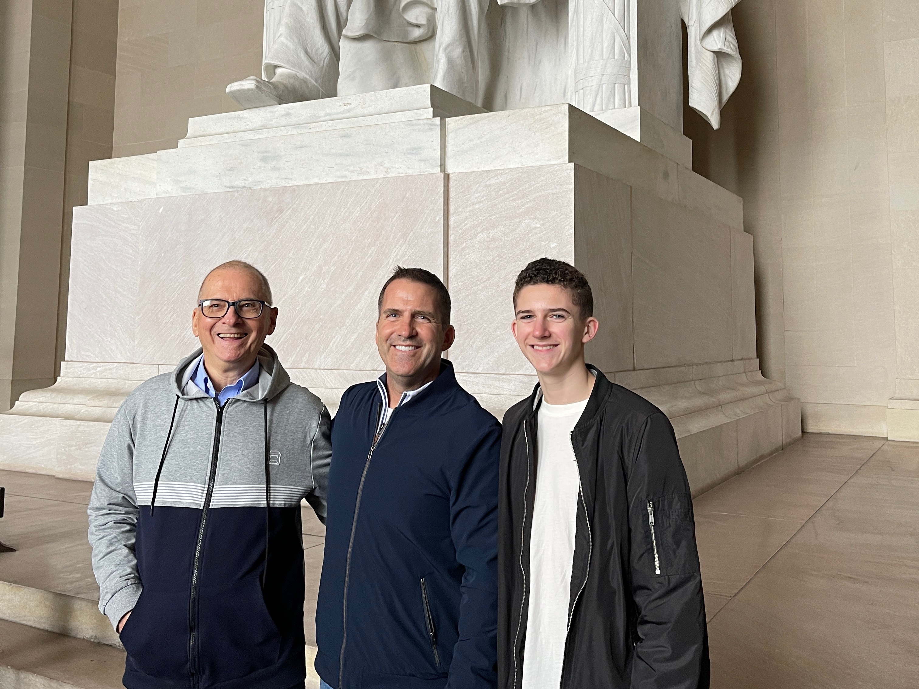 caption: (From left) Donald Kabara, his son Tim, and his grandson Harrison on a 2023 trip to D.C.