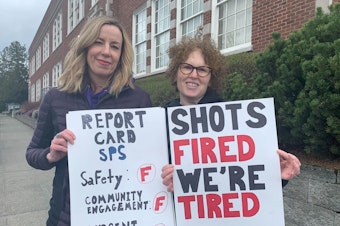 caption: Melanie Skinner (left) and Karen Emmerman Mazner (right). Garfield High School parents held a demonstration Wednesday, March 20, 2024 along 23rd Avenue in the wake of a shooting at a nearby bus stop. Parents argue that school, city, and police officials are not doing enough to find solutions to gun violence in Seattle. 