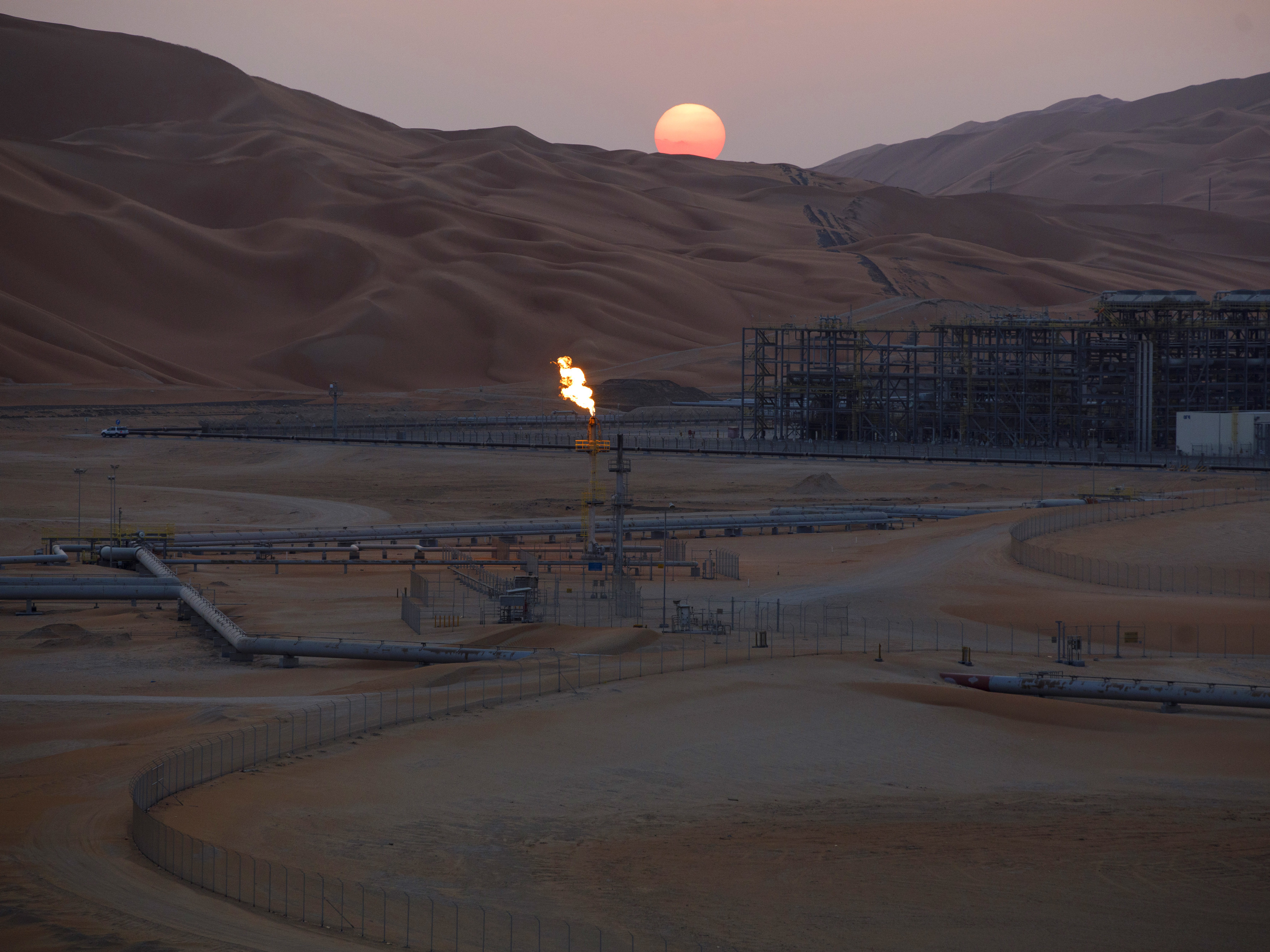 caption: An oil processing facility in Saudi Arabia. The country, along with other OPEC+ members, plans to cut production against the wishes of the U.S.