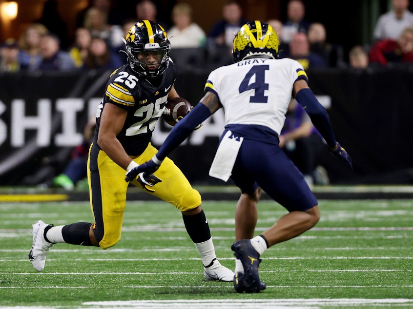 caption: Player advocates say the new exclusive broadcast deal signed by the Big Ten athletic conference is further evidence that college football is no longer amateurism.